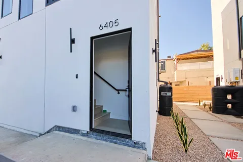 a view of a hallway with a living room