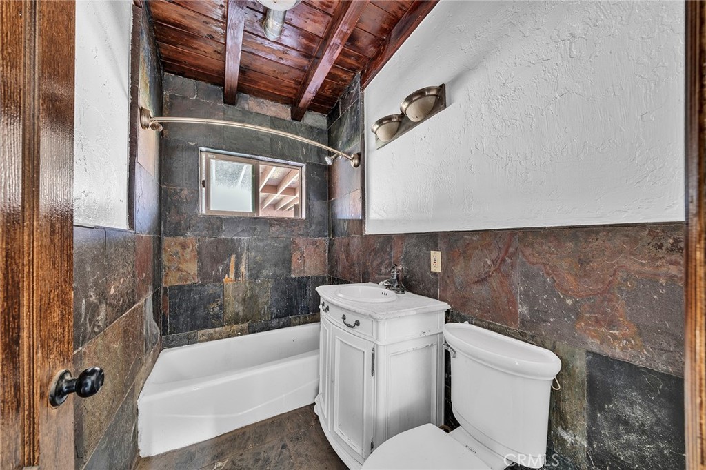 31516 Clay River Road Barstow, CA 92311 - Photo 35 of 73 a bathroom with a toilet sink and tub
