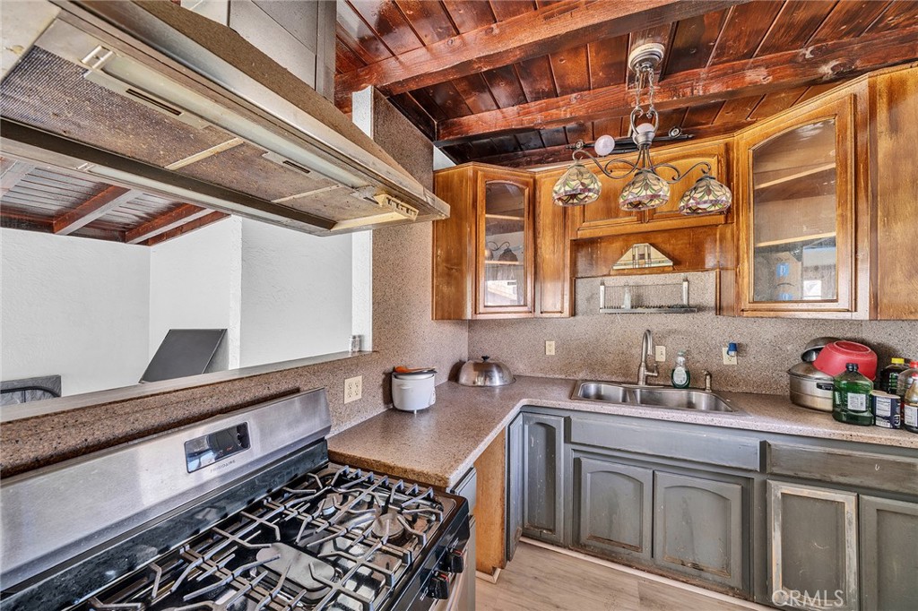 31516 Clay River Road Barstow, CA 92311 - Photo 42 of 73 a kitchen with stainless steel appliances granite countertop a sink stove and cabinets