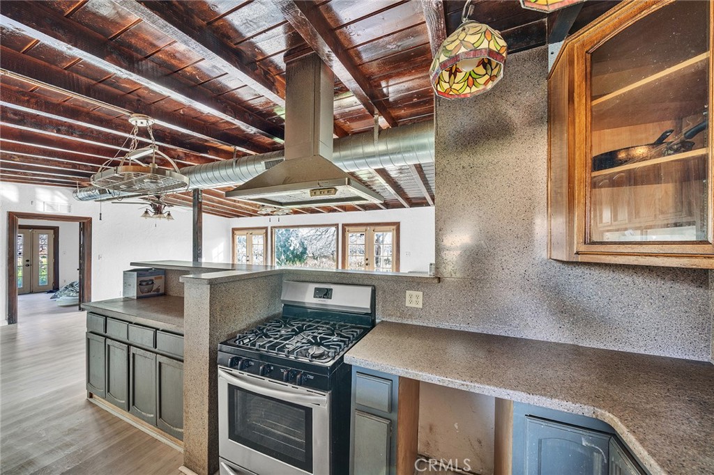 31516 Clay River Road Barstow, CA 92311 - Photo 43 of 73 a kitchen with a stove and a table