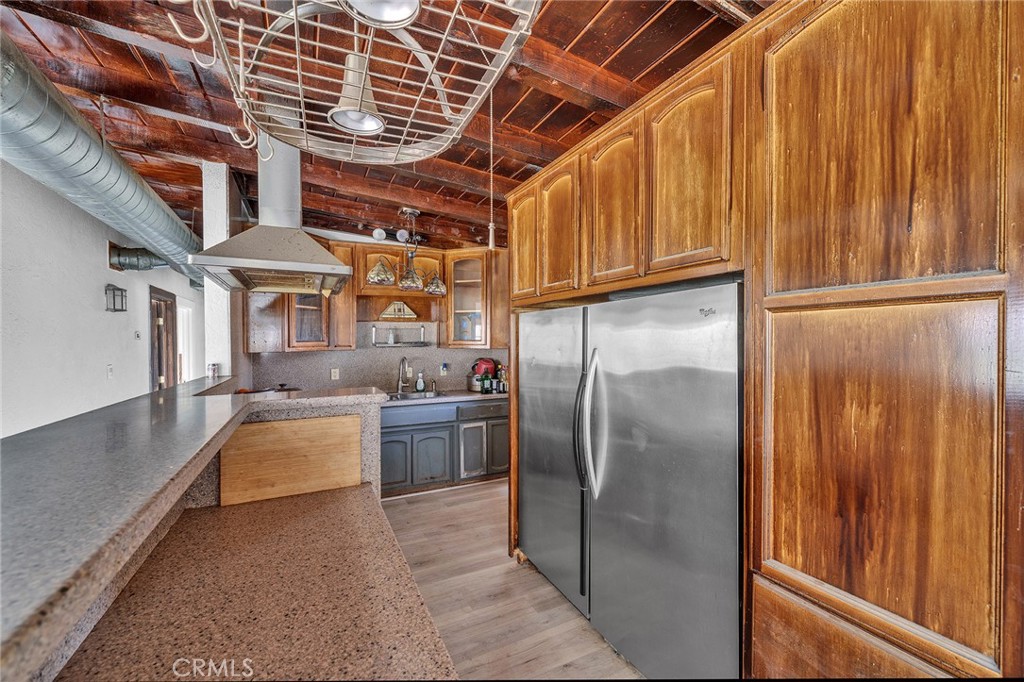 31516 Clay River Road Barstow, CA 92311 - Photo 44 of 73 a kitchen with stainless steel appliances granite countertop a refrigerator and a sink