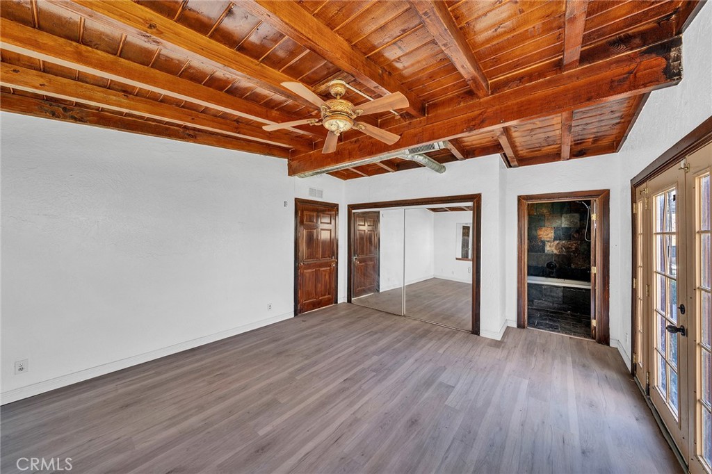31516 Clay River Road Barstow, CA 92311 - Photo 47 of 73 an empty room with wooden floor and windows