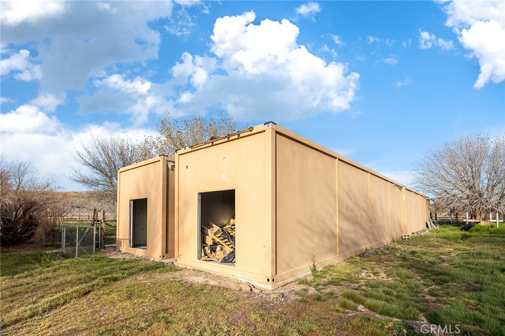 31516 Clay River Road Barstow, CA 92311 - Photo 57 of 73 a view of a wooden house with a yard