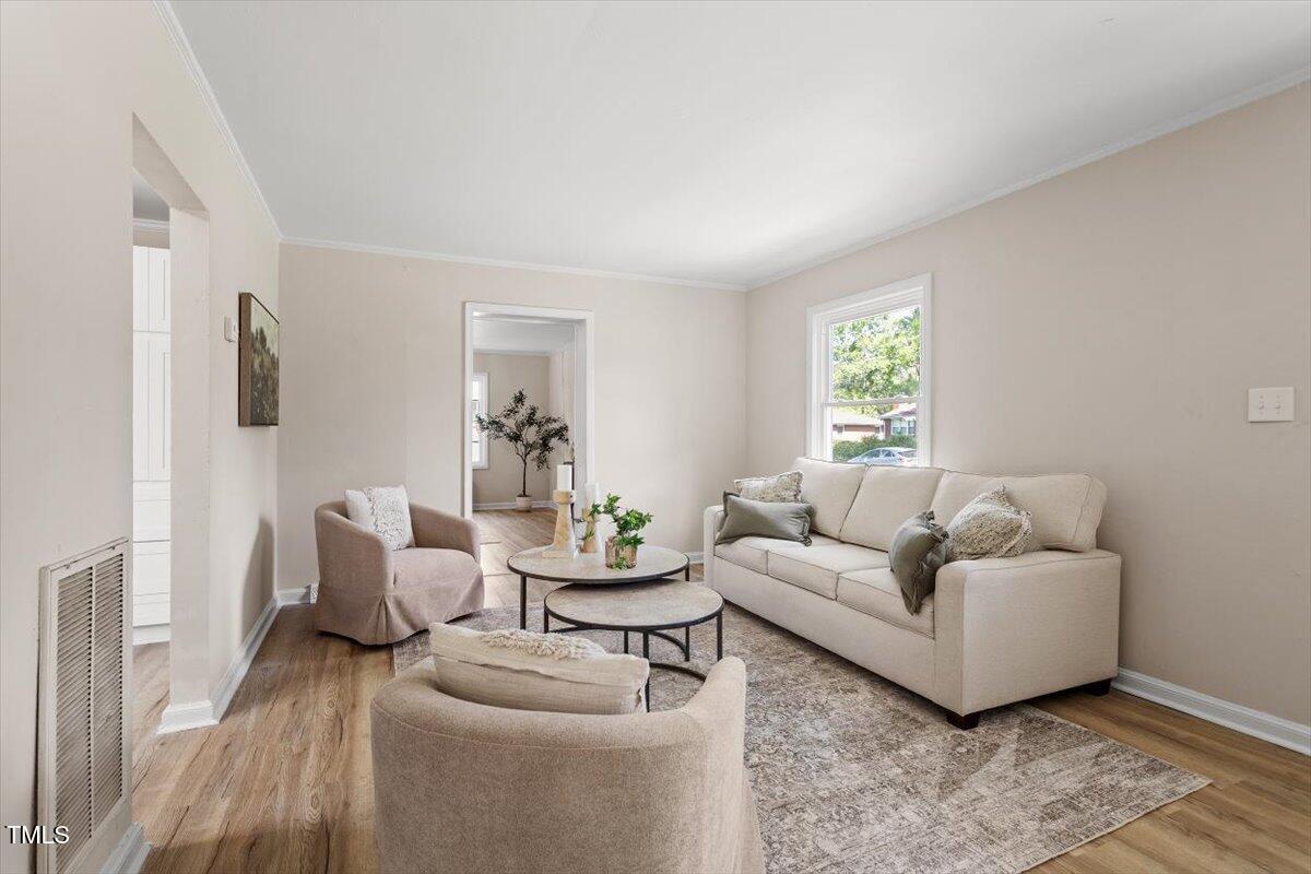 2304 Nelson Street Raleigh, NC 27610 - Photo 6 of 23 a living room with furniture and a large window