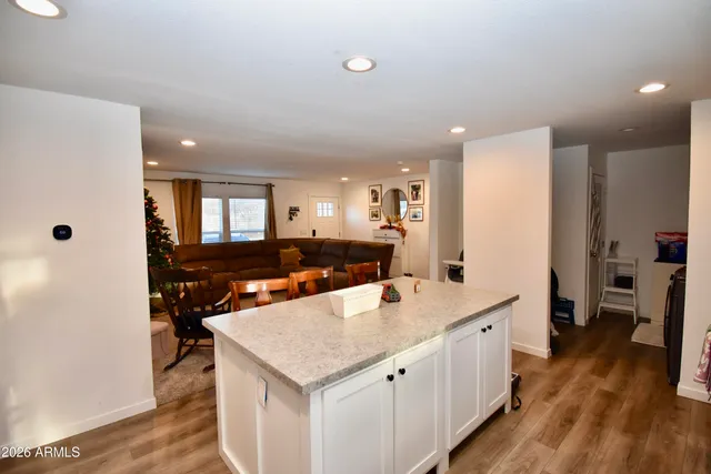 a large kitchen with a table and chairs