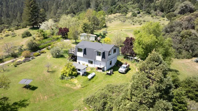 an aerial view of residential house with outdoor space