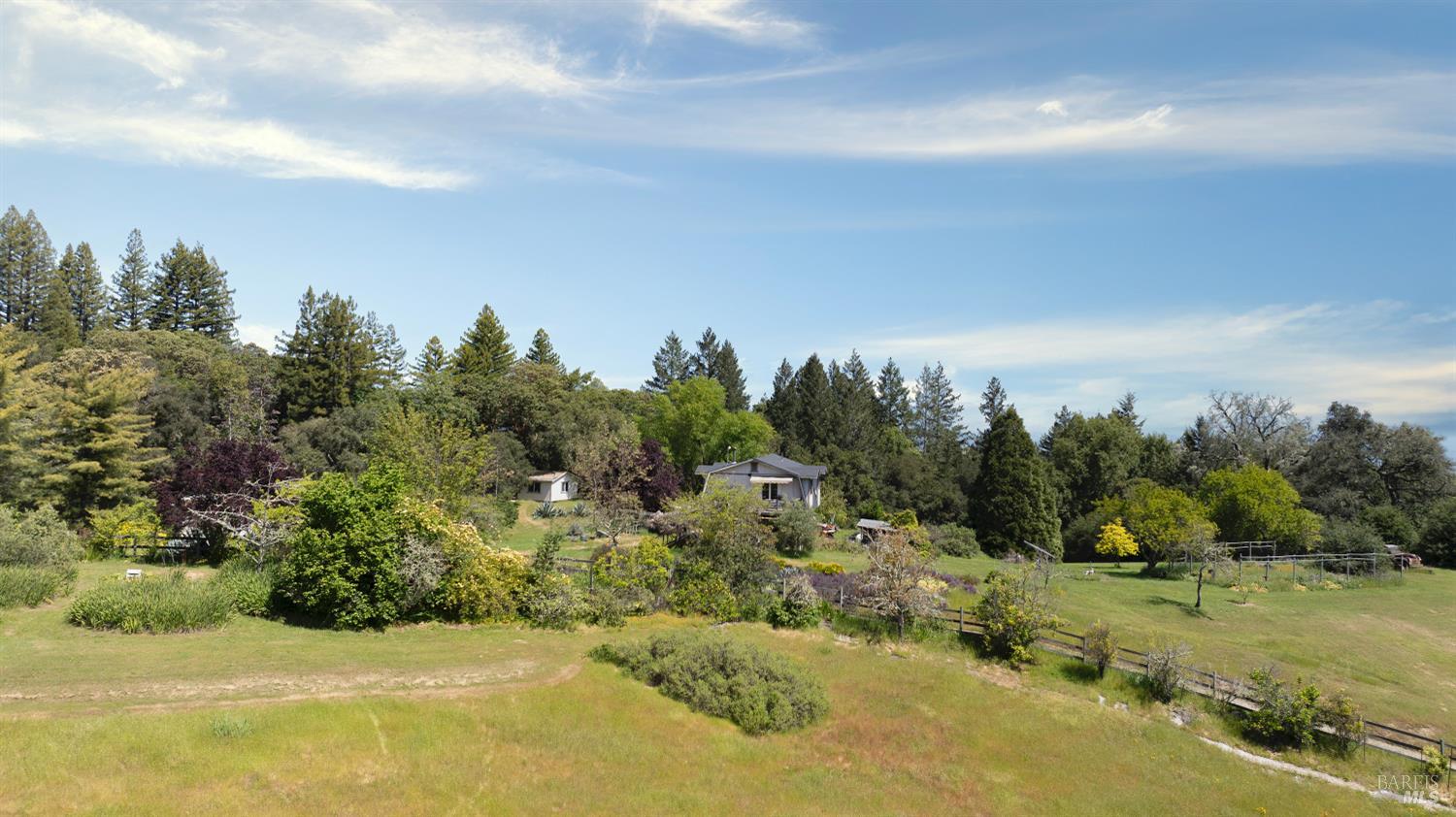 10957 Westside Road Healdsburg, CA 95448 - Photo 27 of 30 an aerial view of a houses with yard and mountain view in back