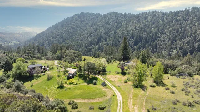 a view of a swimming pool with a yard