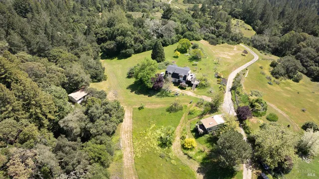 a front view of house with yard and green space