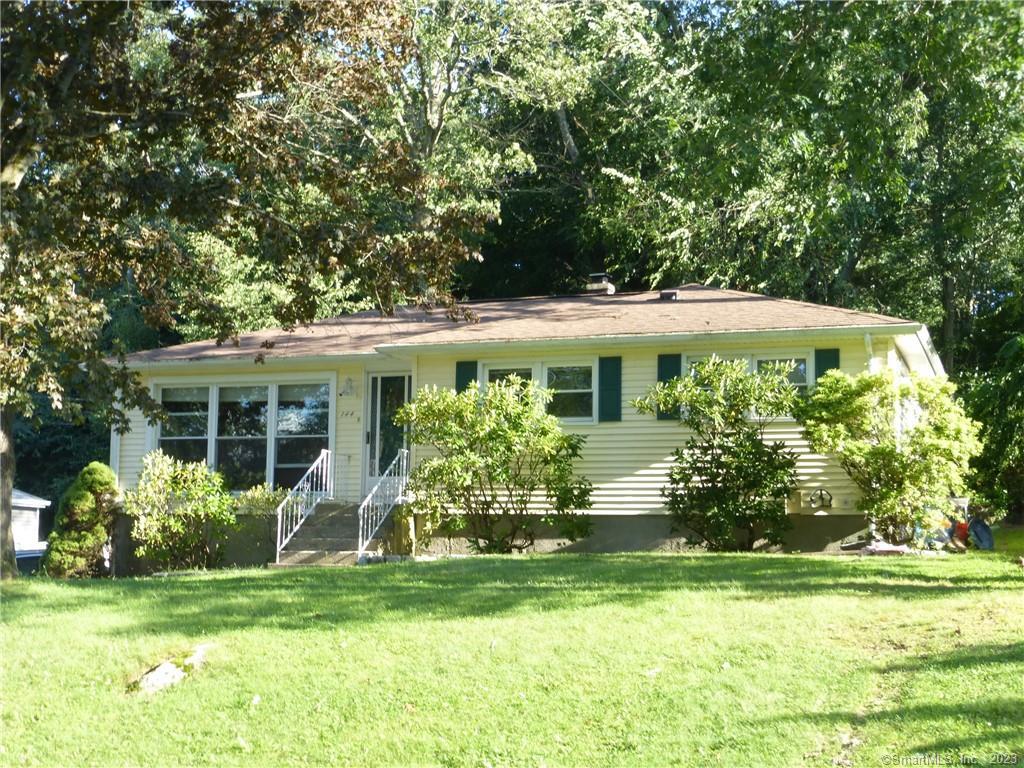 144 Harwood Road Waterbury, CT 06706 - Photo 1 of 1 a front view of house with a garden