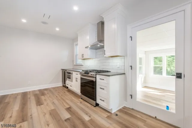 a kitchen with a stove and a sink