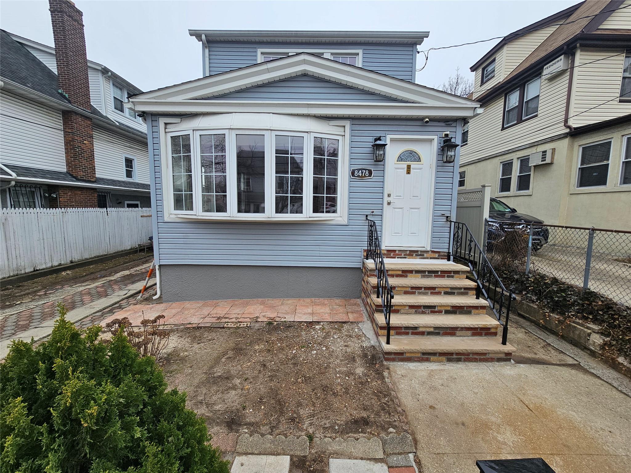 a view of a house with a window and stairs