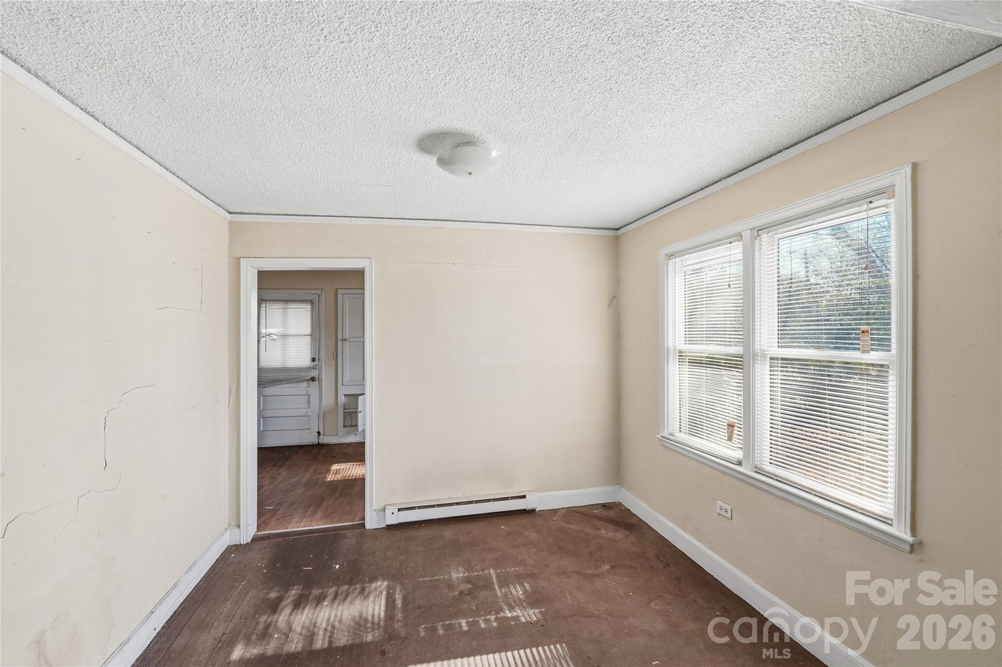 3309 Ritch Avenue Charlotte, NC 28206 - Photo 11 of 25 an empty room with windows and closet