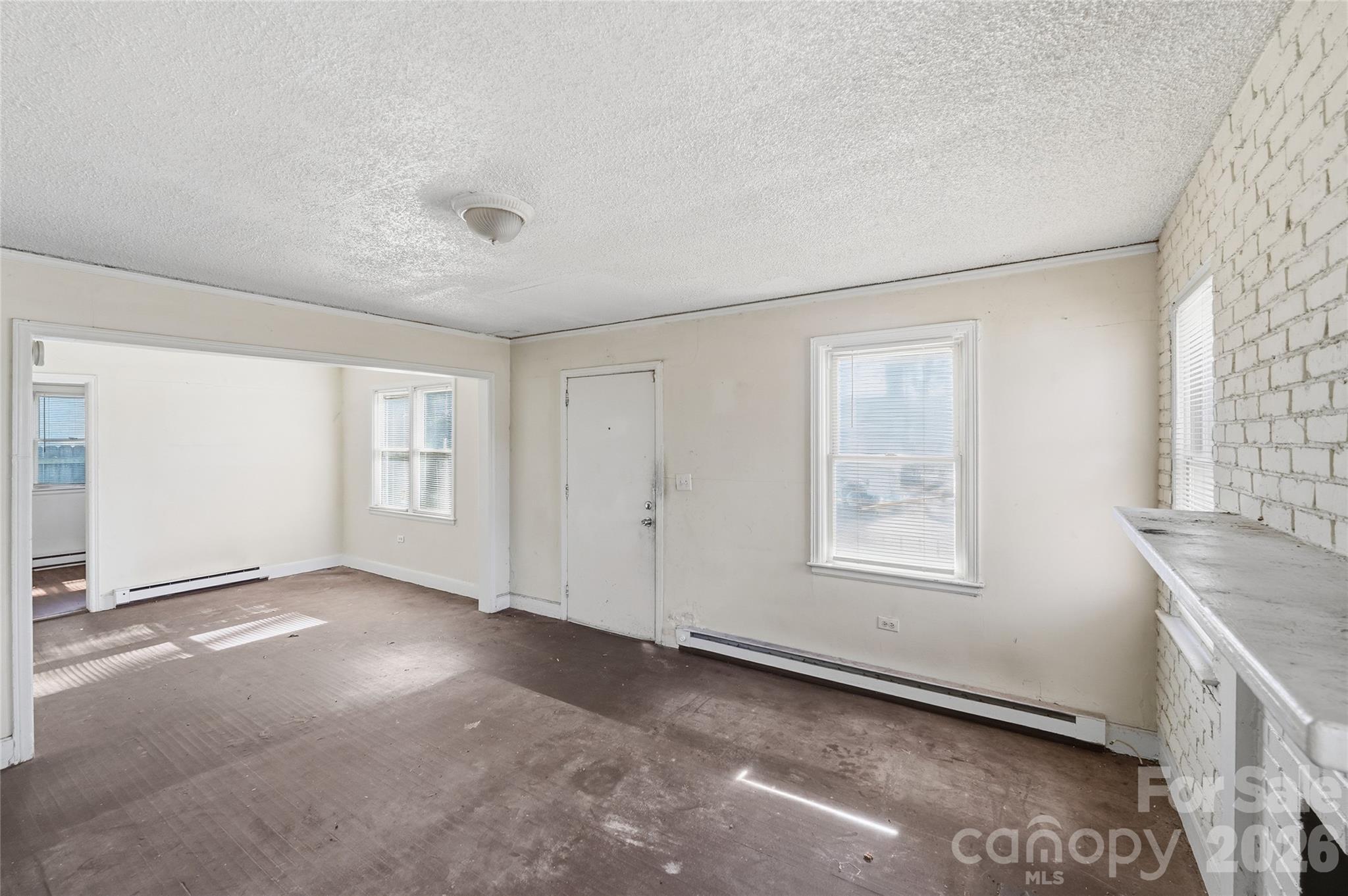 3309 Ritch Avenue Charlotte, NC 28206 - Photo 3 of 25 an empty room with windows