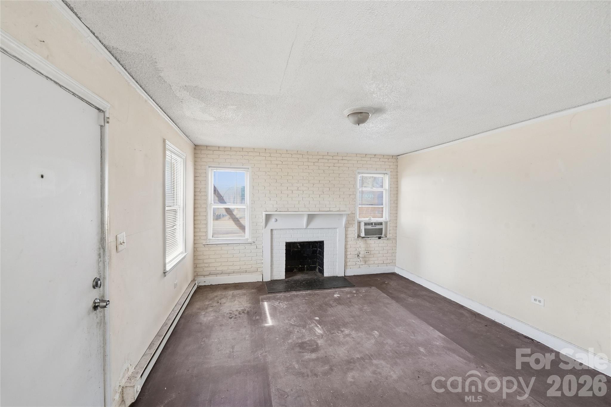 3309 Ritch Avenue Charlotte, NC 28206 - Photo 7 of 25 a view of empty room with fireplace