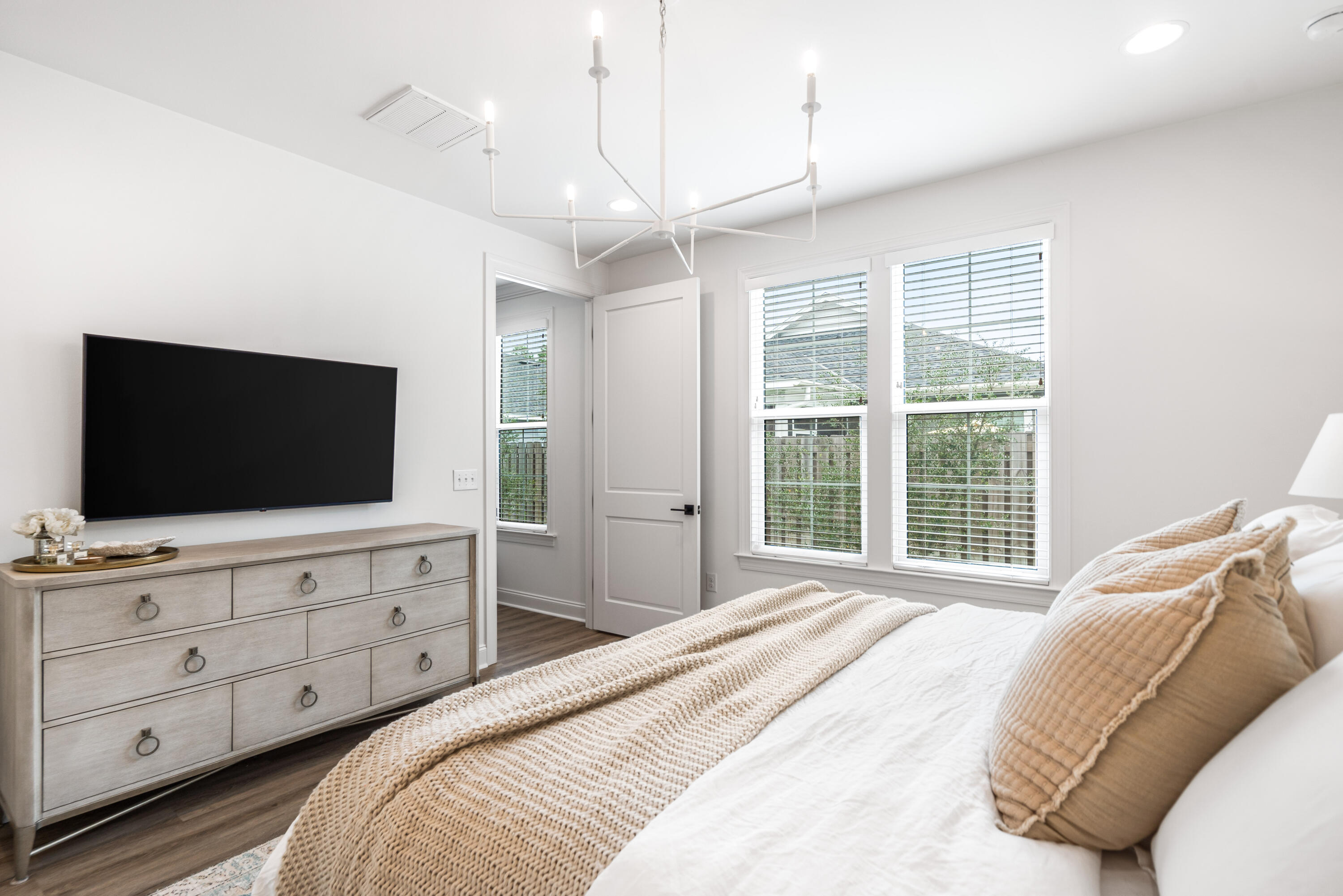 99 Roundwood Dr Inlet Beach Inlet Beach, FL 32461 - Photo 11 of 24 a bedroom with a large bed and a flat screen tv
