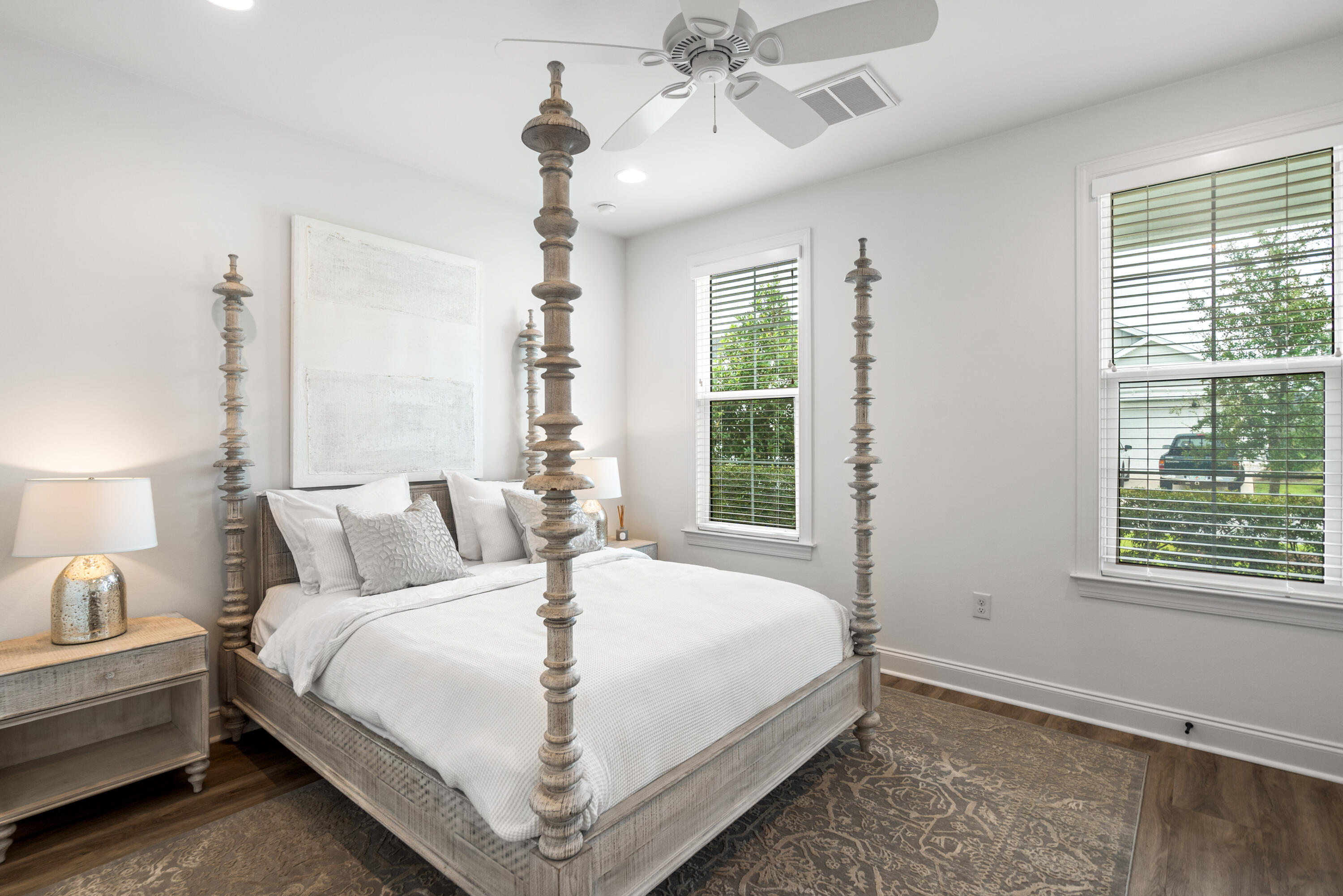 99 Roundwood Dr Inlet Beach Inlet Beach, FL 32461 - Photo 18 of 24 a bedroom with a large bed and a chandelier fan