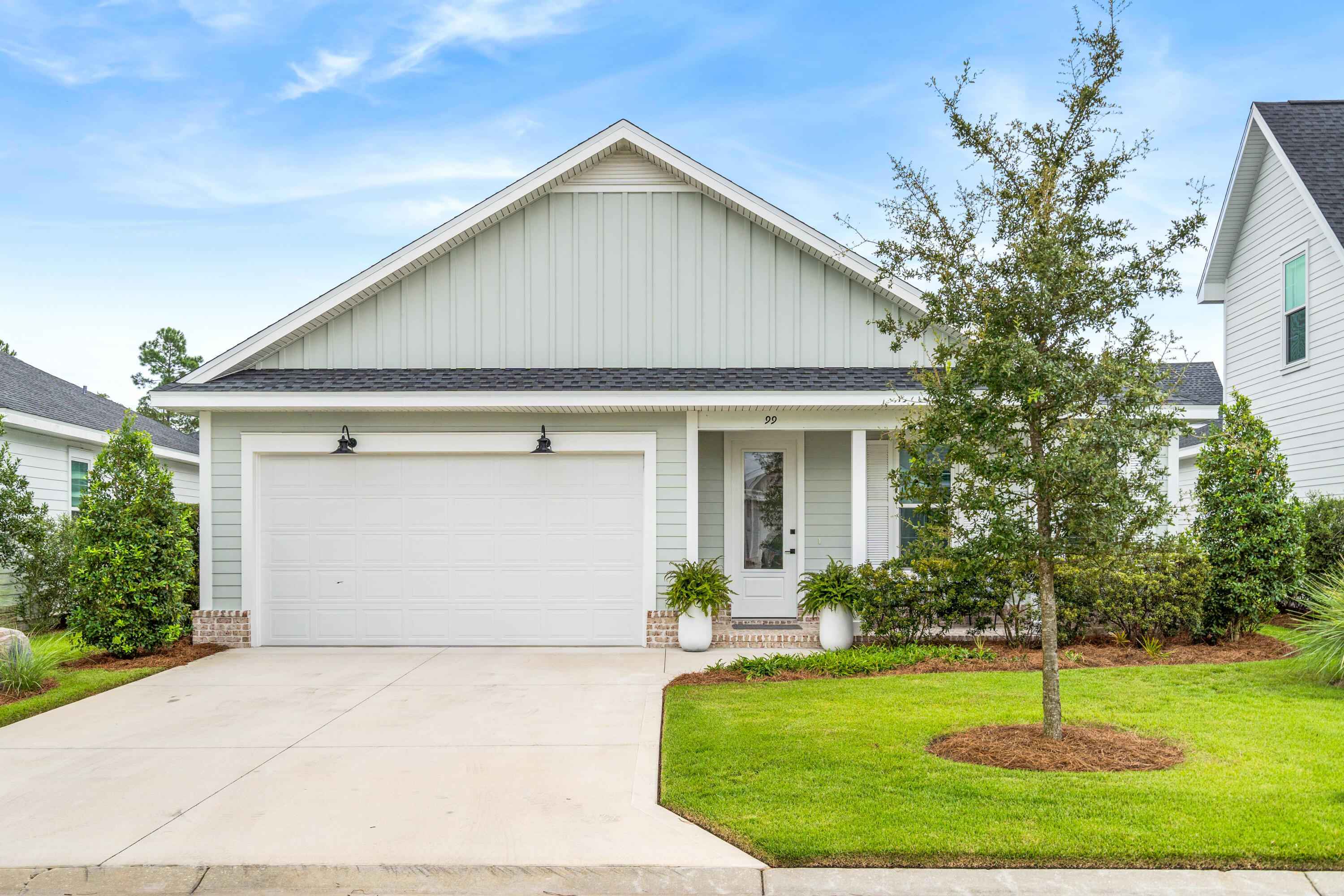 99 Roundwood Dr Inlet Beach Inlet Beach, FL 32461 - Photo 23 of 24 a front view of a house with a yard
