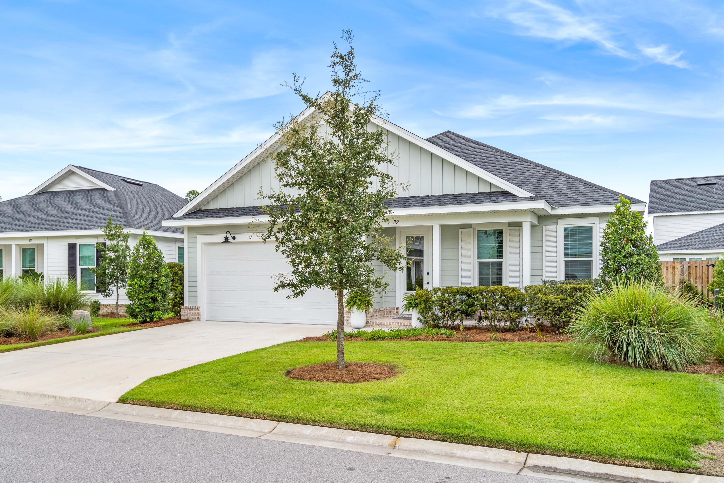 99 Roundwood Dr Inlet Beach Inlet Beach, FL 32461 - Photo 24 of 24 a front view of a house with a garden