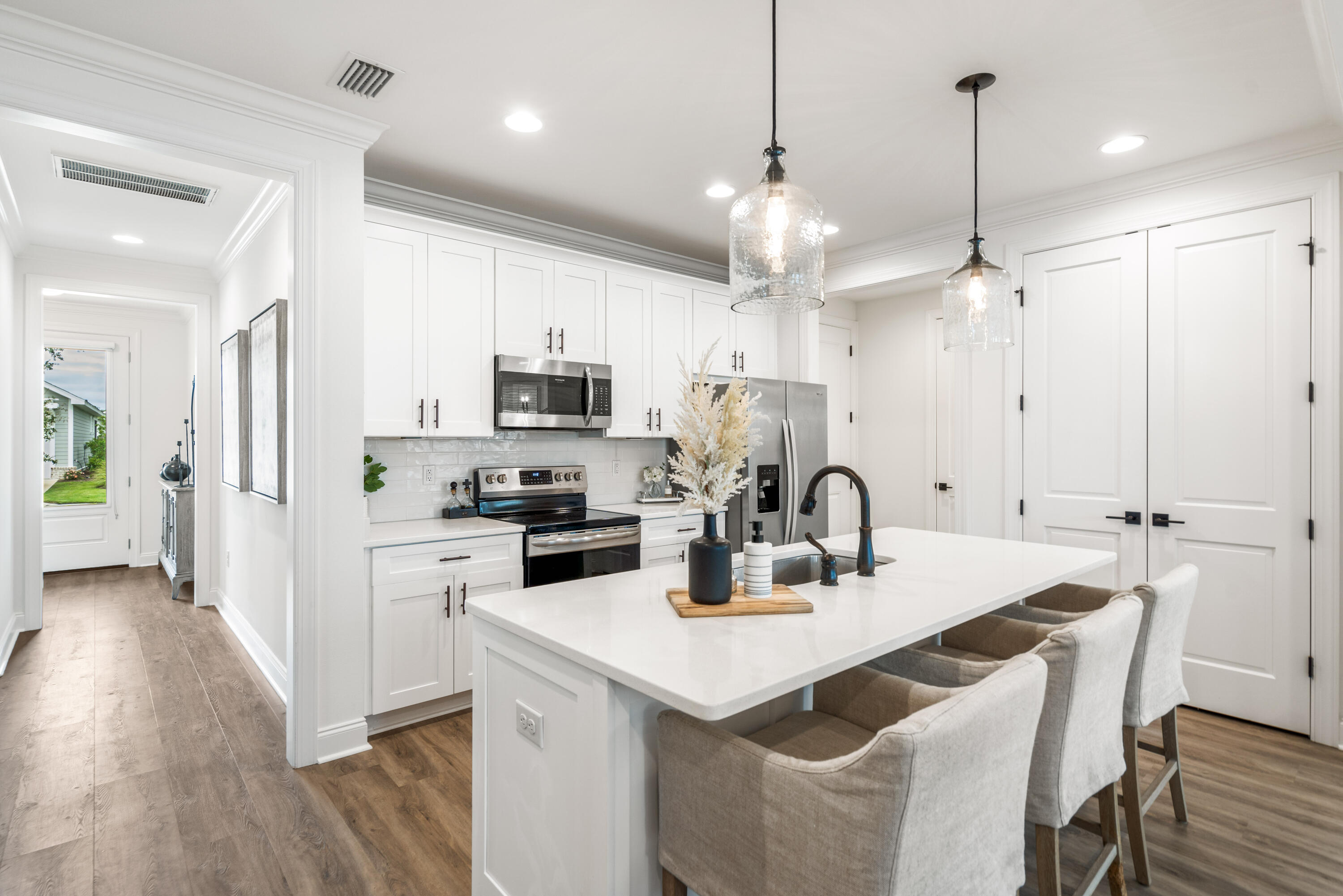 99 Roundwood Dr Inlet Beach Inlet Beach, FL 32461 - Photo 6 of 24 a kitchen with kitchen island a sink a center island a counter space and a dining table
