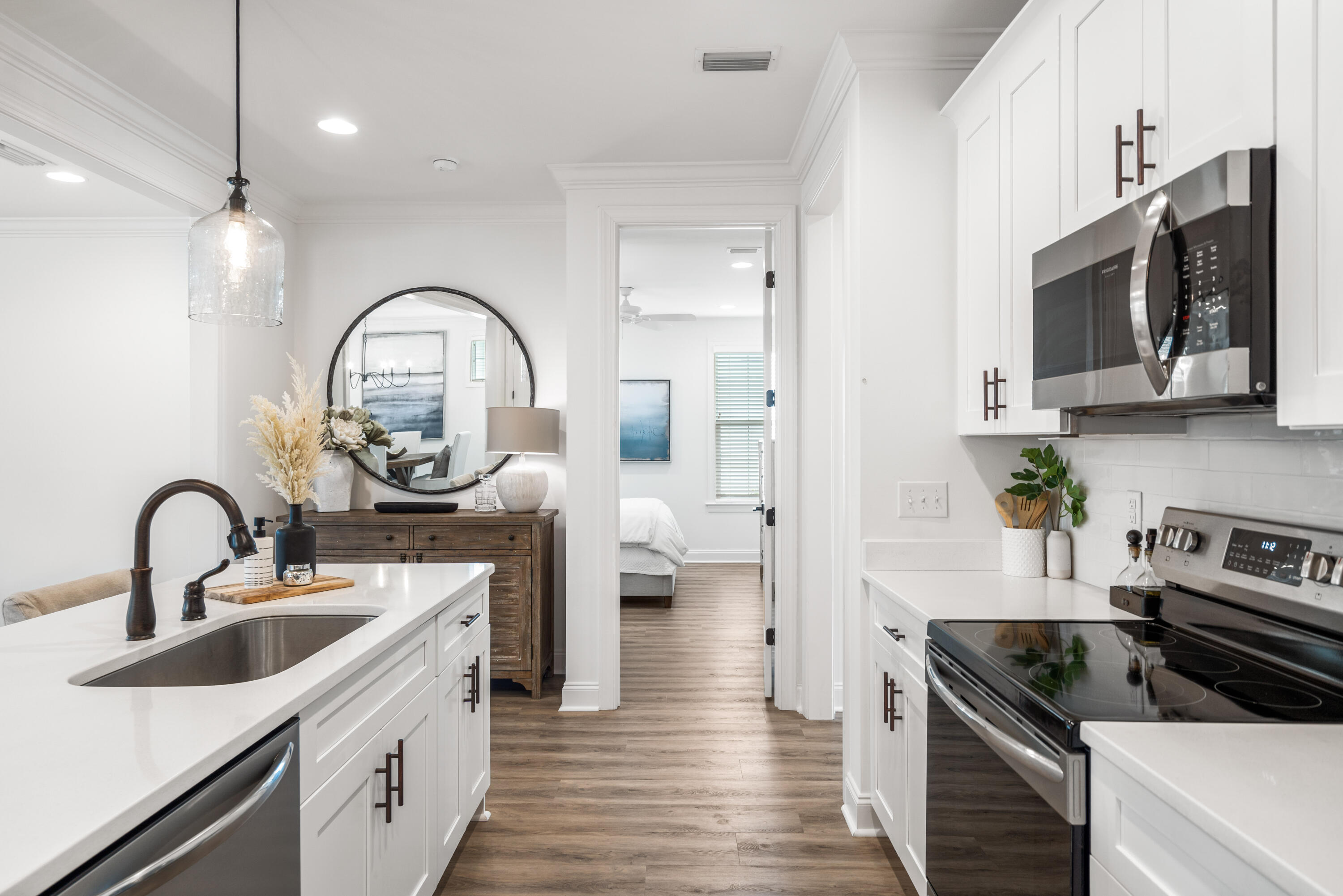 99 Roundwood Dr Inlet Beach Inlet Beach, FL 32461 - Photo 8 of 24 a kitchen with stainless steel appliances a sink a stove and cabinets