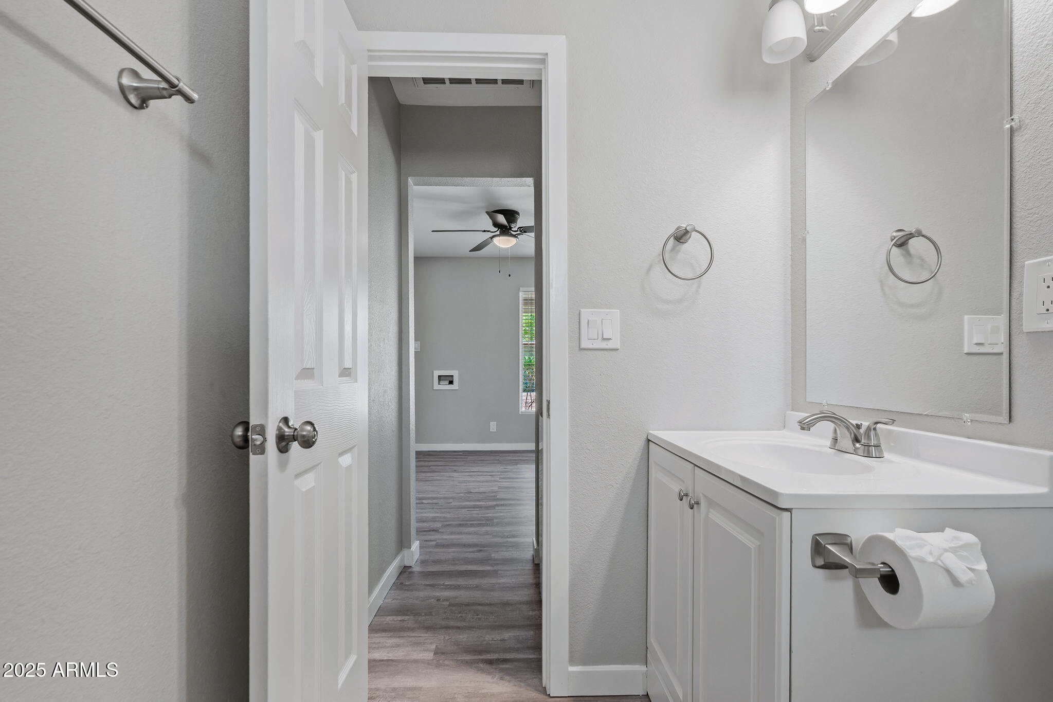 1940 West Amelia Avenue, Unit 1940 5 Phoenix, AZ 85015 - Photo 8 of 14 a bathroom with a shower sink and mirror