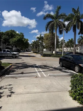 a view of a yard and car parked