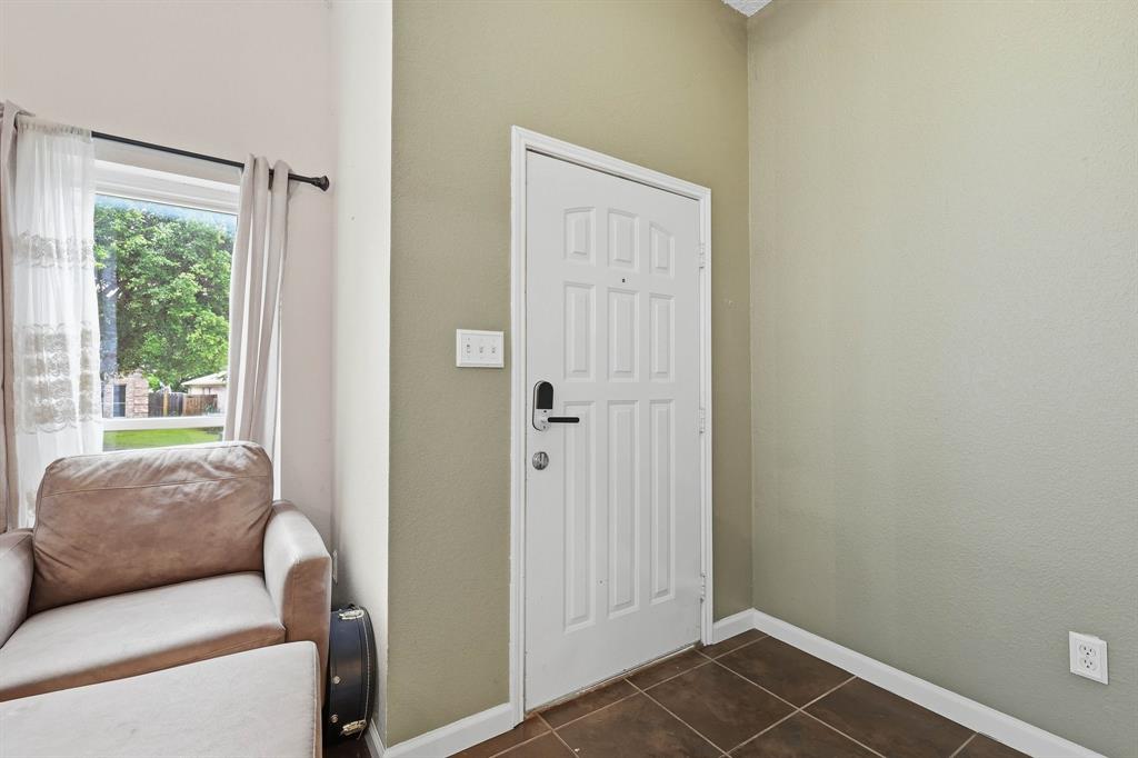 4217 Broken Arrow Road Fort Worth, TX 76137 - Photo 5 of 40 a living room with furniture and a window