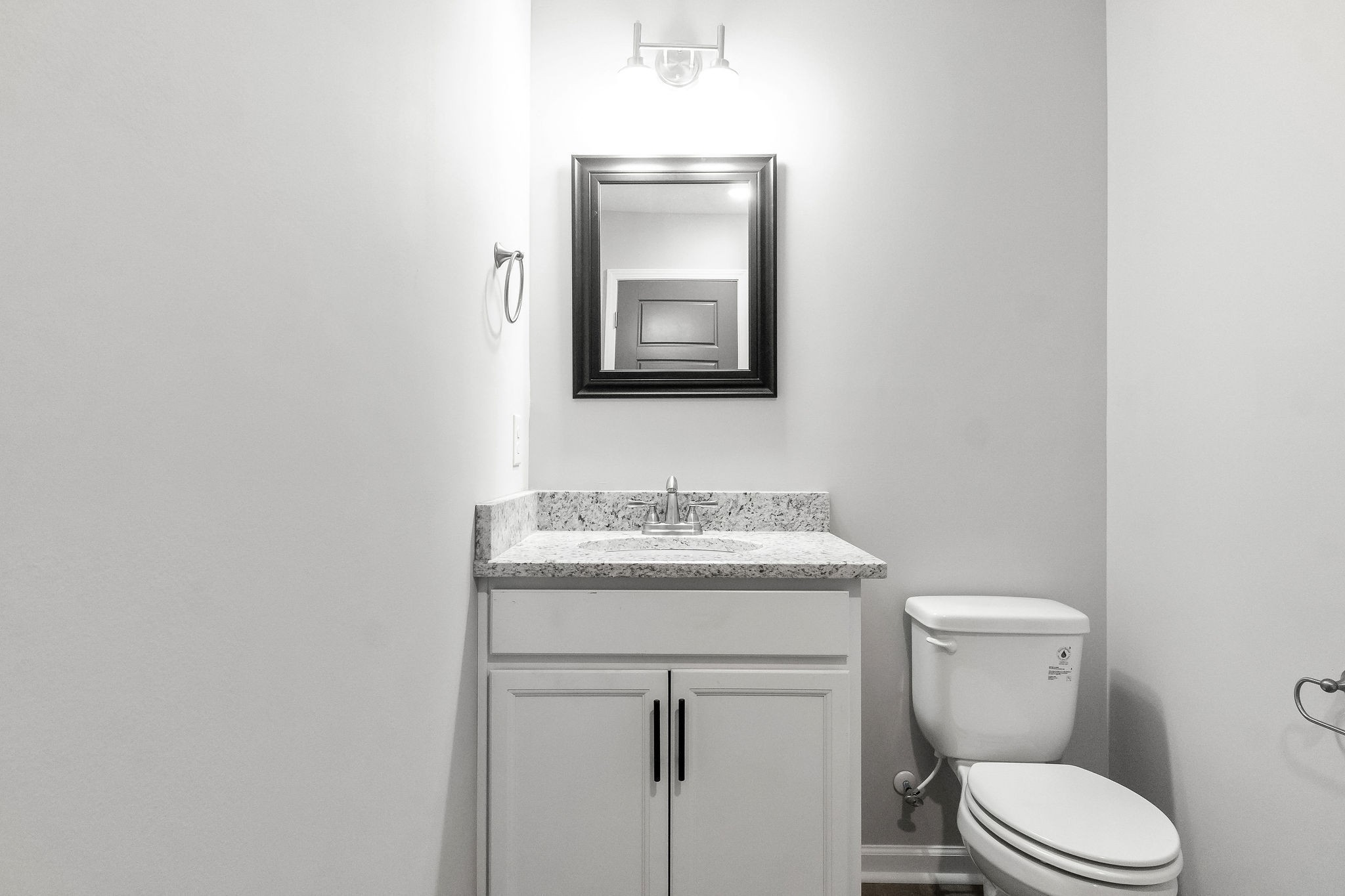 303 Longshadow Trail, Unit E Clarksville, TN 37043 - Photo 15 of 29 a bathroom with a toilet a sink and mirror
