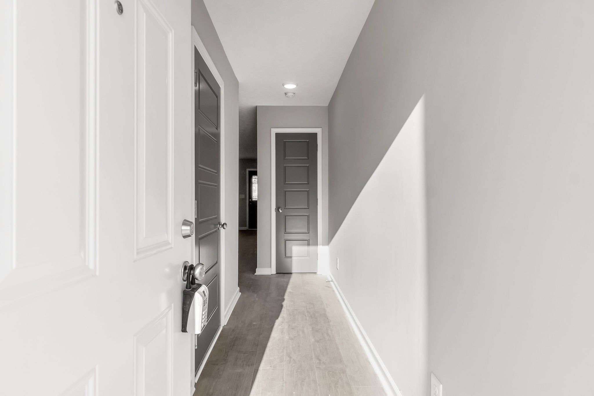 303 Longshadow Trail, Unit E Clarksville, TN 37043 - Photo 2 of 29 a view of a hallway with white walls and stairs