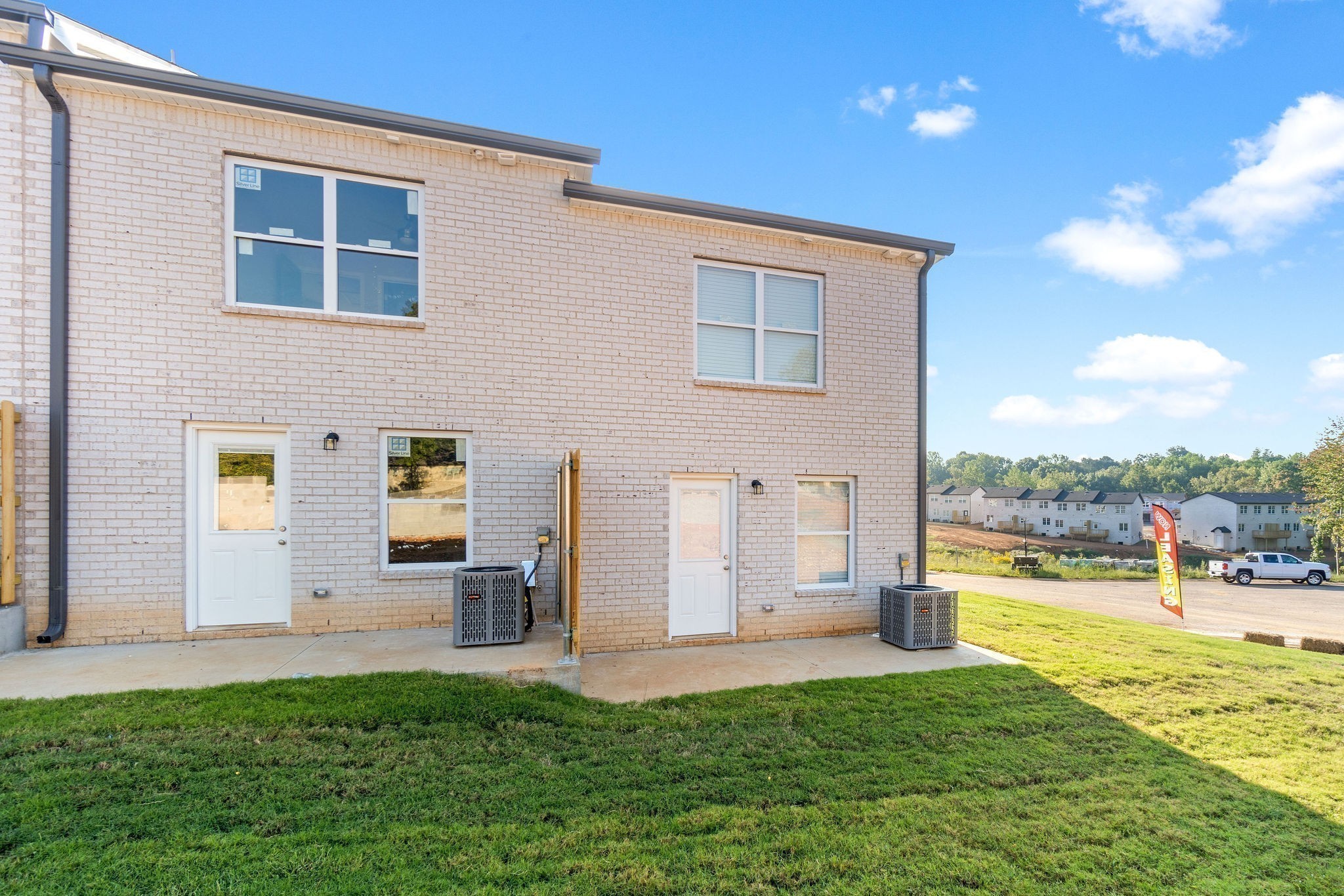 303 Longshadow Trail, Unit E Clarksville, TN 37043 - Photo 22 of 29 a view of a house with a yard