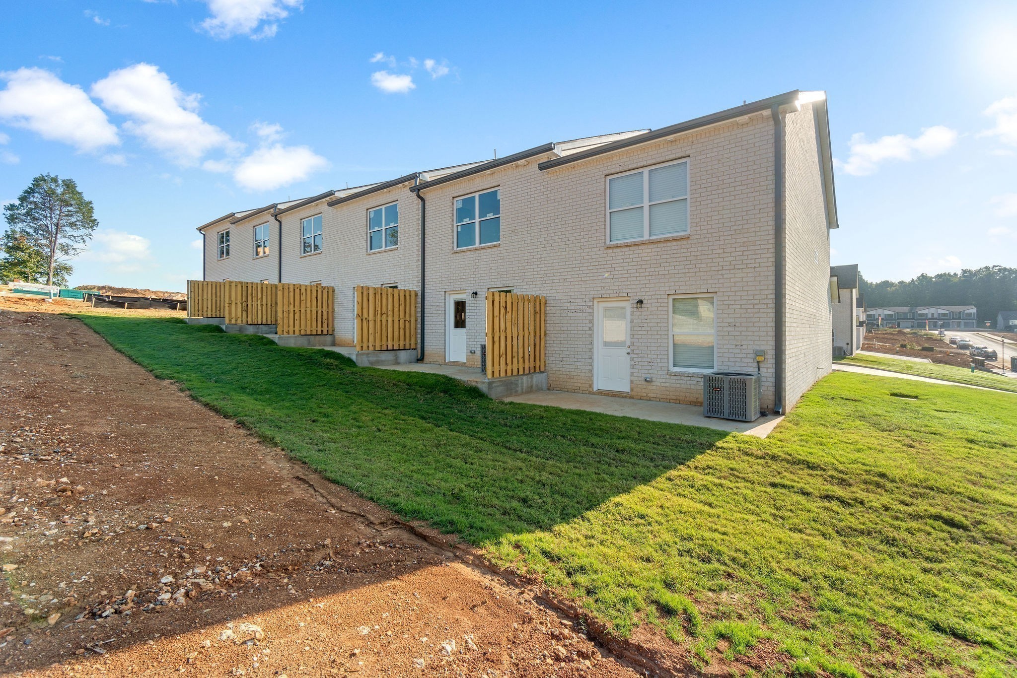 303 Longshadow Trail, Unit E Clarksville, TN 37043 - Photo 26 of 29 a view of a backyard with plants and a garden