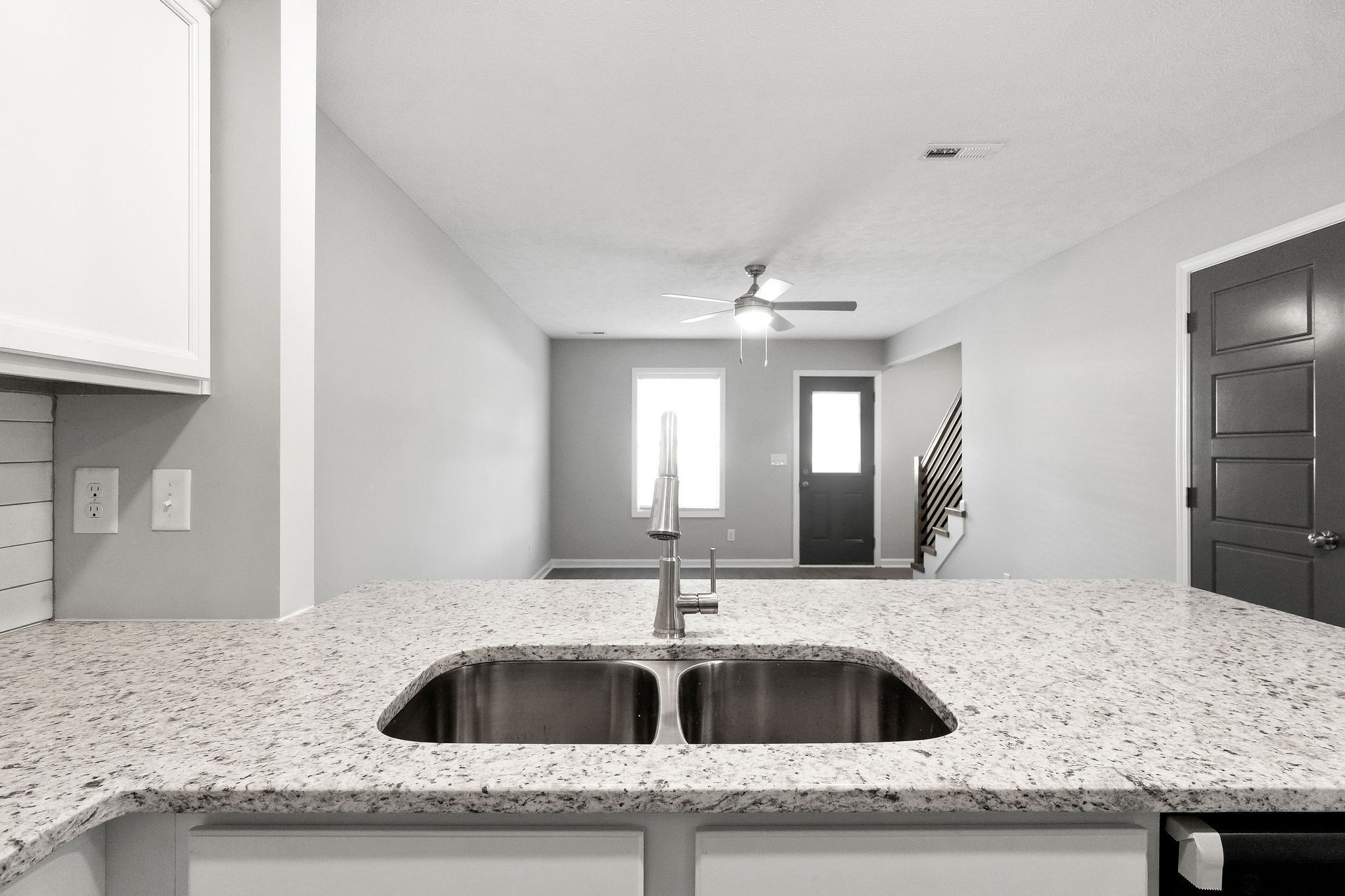 303 Longshadow Trail, Unit E Clarksville, TN 37043 - Photo 5 of 29 a kitchen with granite countertop a sink and cabinets
