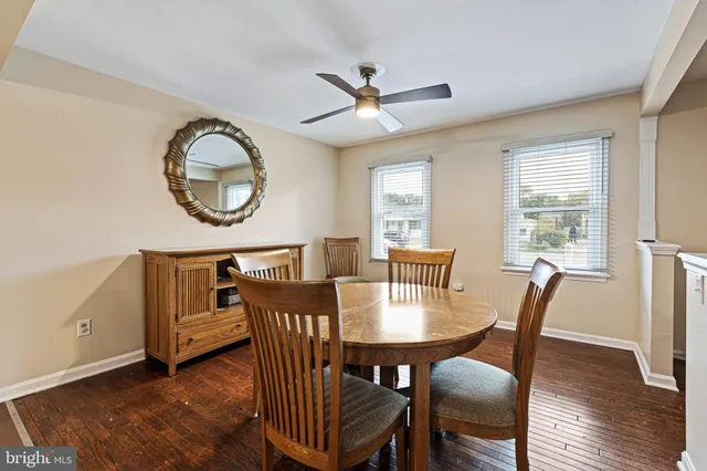 a view of a dining room with furniture and a window