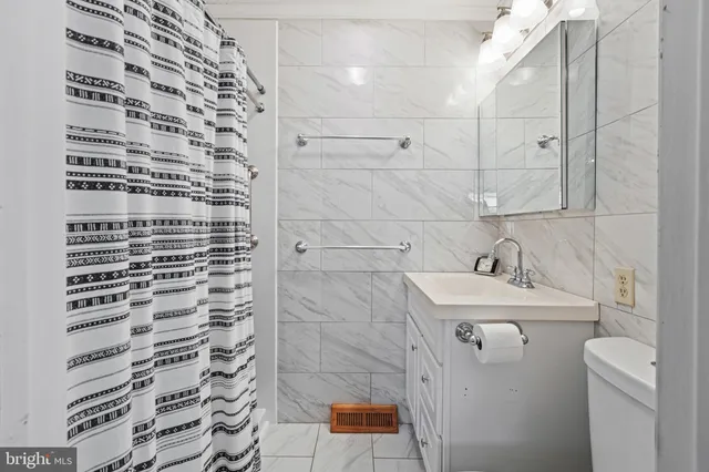 a bathroom with a sink and a shower