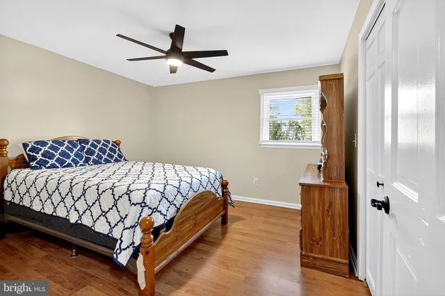 a bedroom with a bed and a dresser