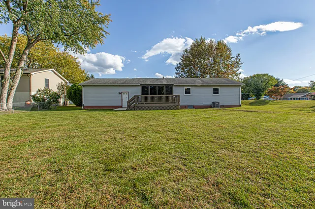 a front view of house with yard and outdoor seating