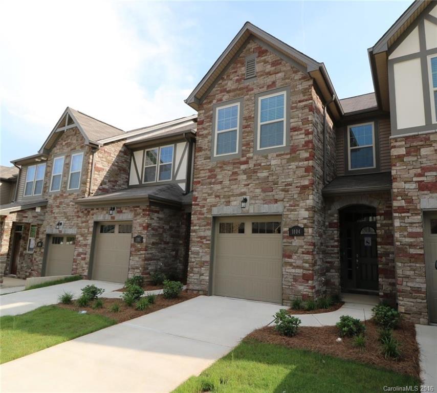 1004 Archibald Avenue Fort Mill, SC 29708 - Photo 1 of 2 a front view of a house with a yard and garage