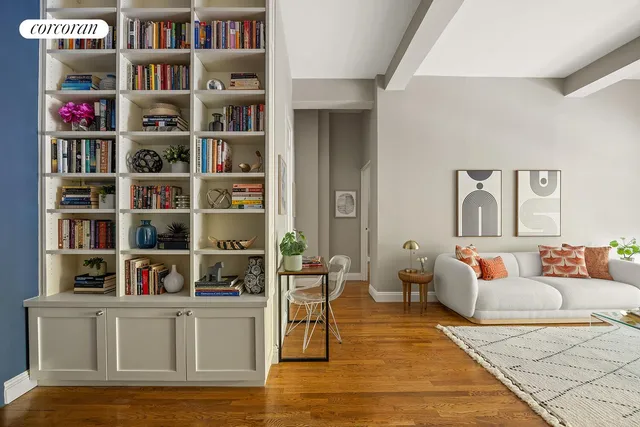 a living room with furniture and a lamp