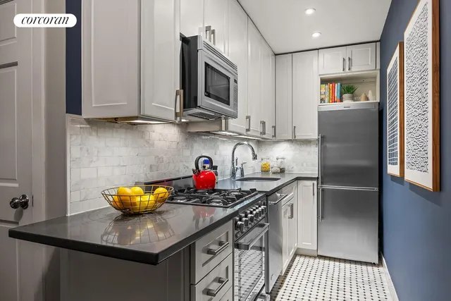 a living room with furniture and a book shelf