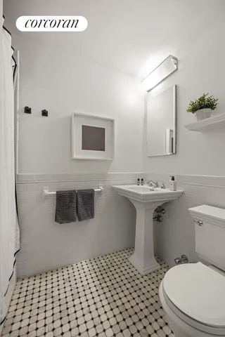 a bedroom with a bed and a flat screen television