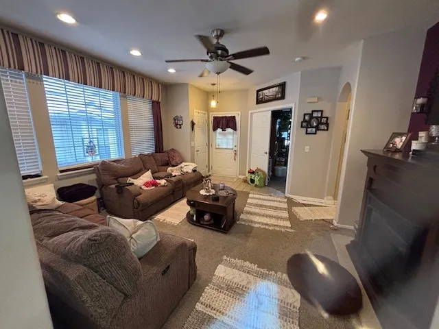 a living room with furniture and a large window