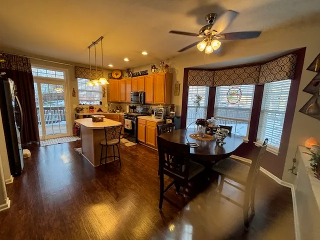a view of a dining room with furniture window and wooden floor