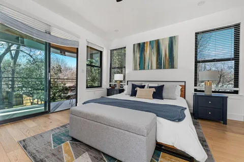 a bedroom with a bed and a dresser