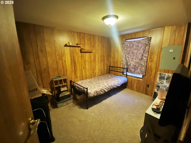 a bedroom with a bed and furniture