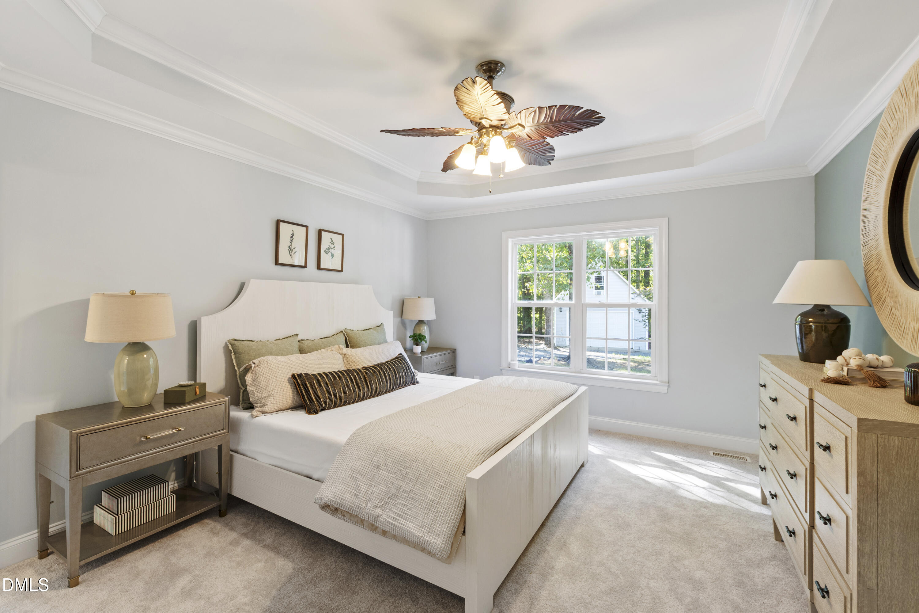 212 Fox Pen Drive Raleigh, NC 27603 - Photo 21 of 56 a bedroom with a bed and a chandelier