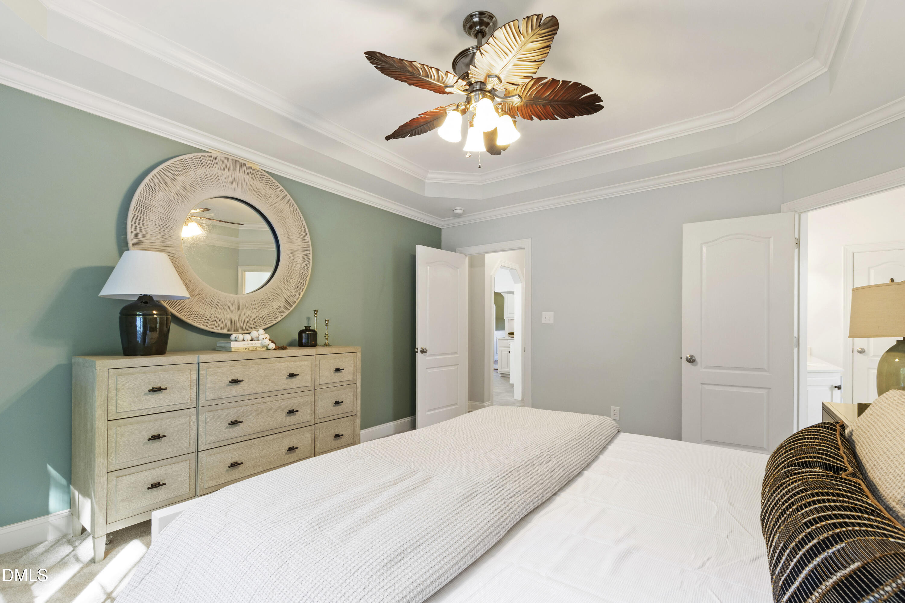 212 Fox Pen Drive Raleigh, NC 27603 - Photo 22 of 56 a bedroom with a bed and a mirror