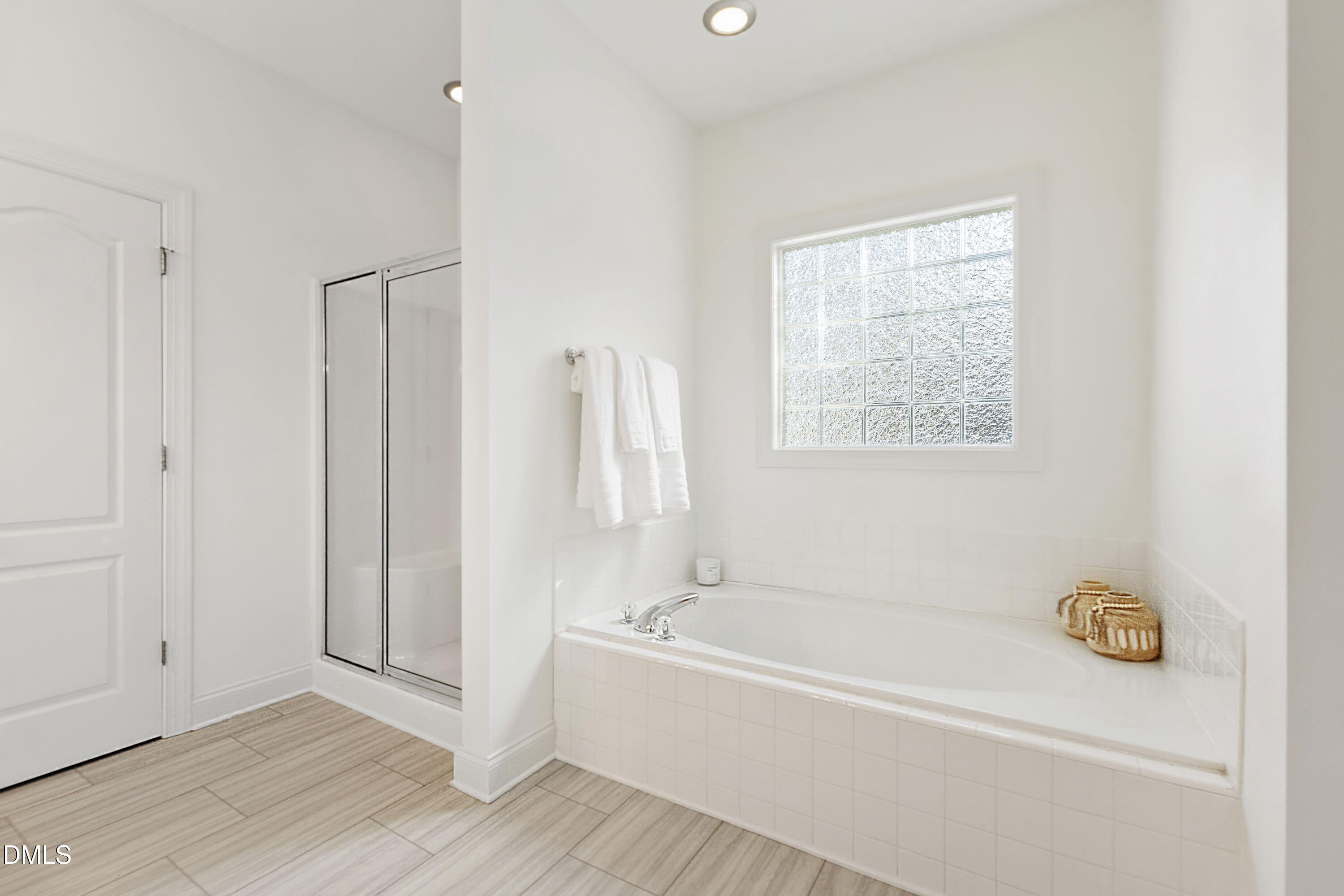 212 Fox Pen Drive Raleigh, NC 27603 - Photo 23 of 56 a white bath tub sitting next to a window