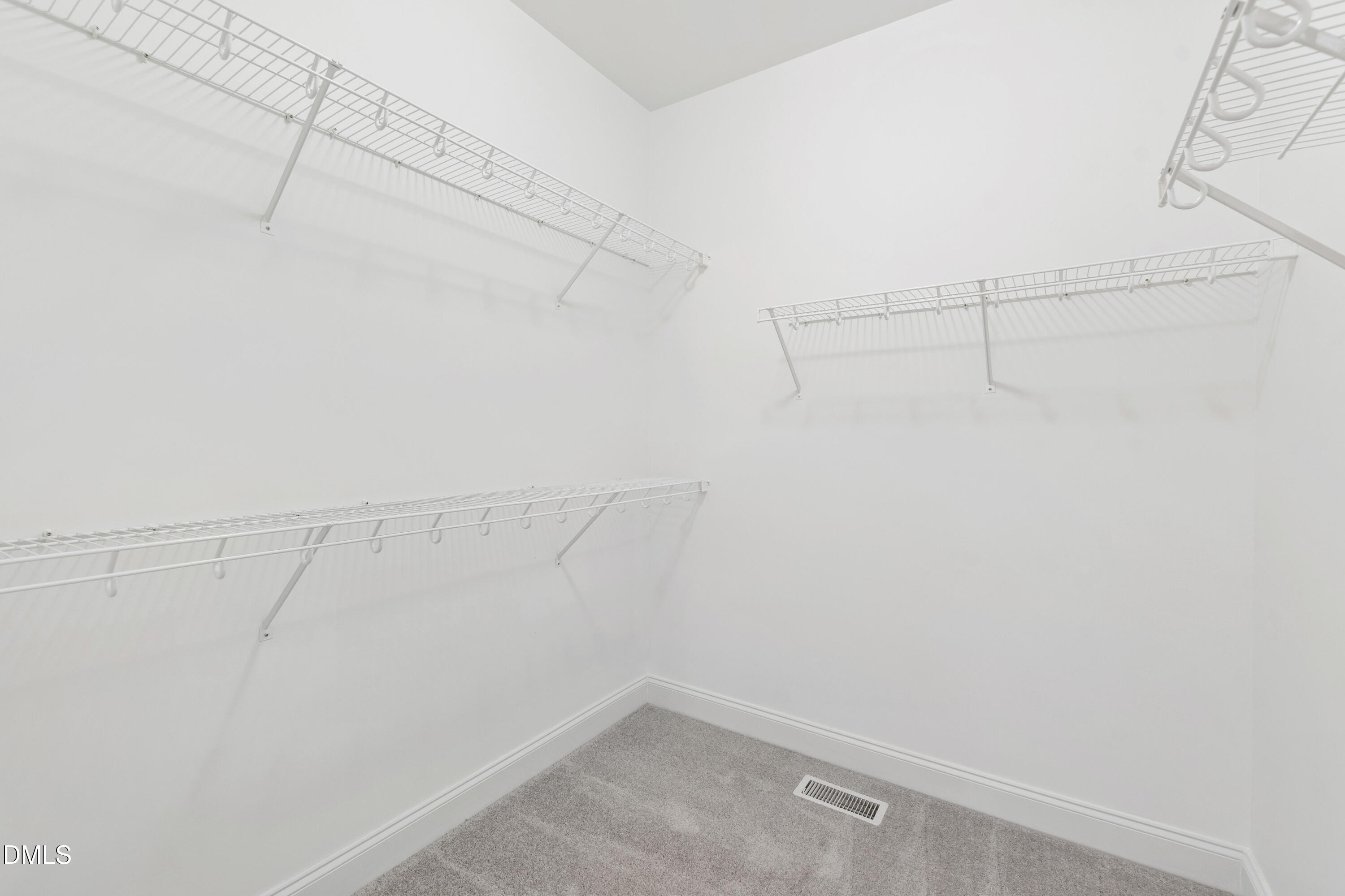 212 Fox Pen Drive Raleigh, NC 27603 - Photo 26 of 56 a view of a room with racks on the wall