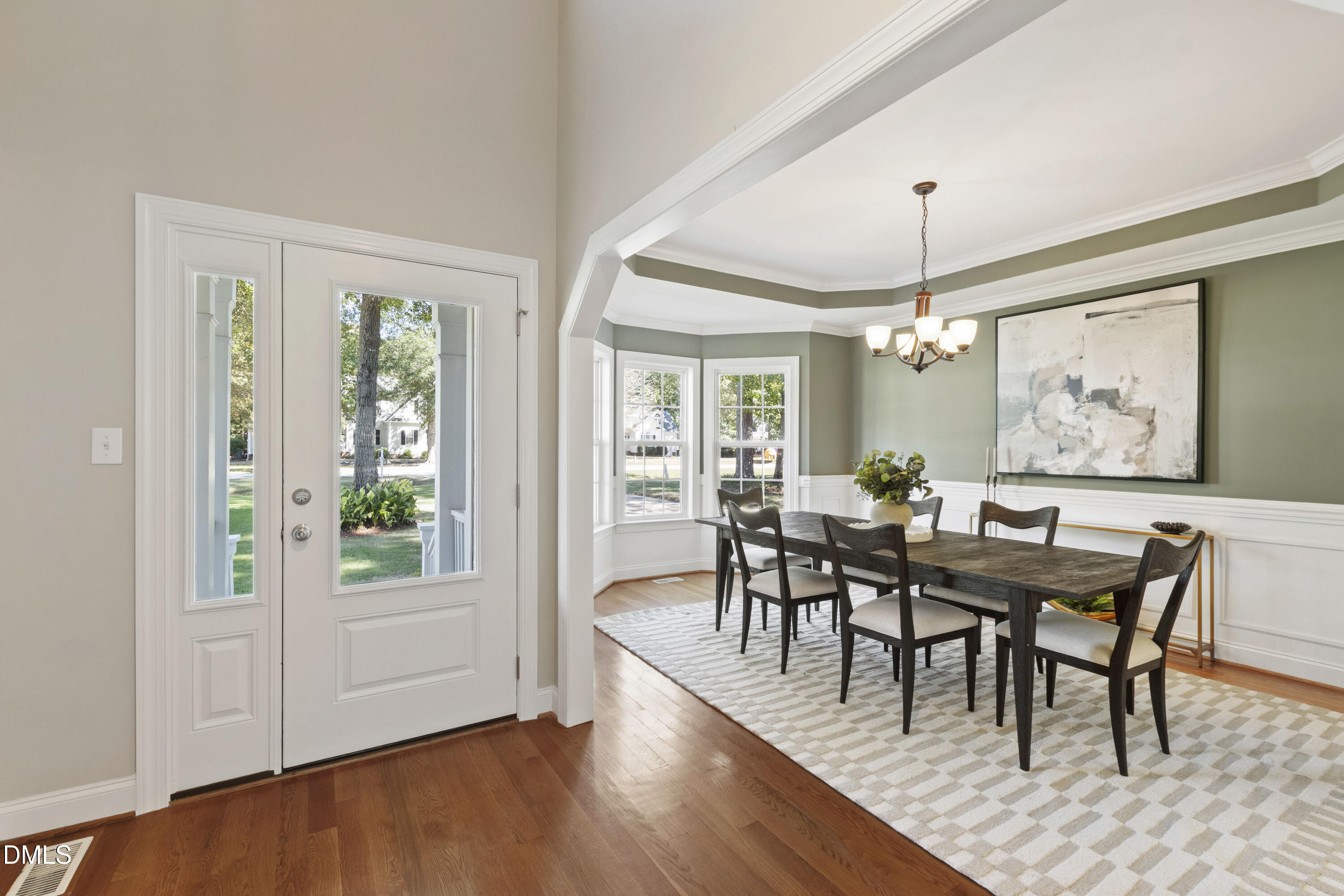 212 Fox Pen Drive Raleigh, NC 27603 - Photo 3 of 56 a view of a dining room with furniture window and wooden floor